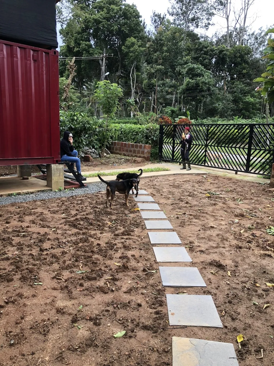 Stone path through the garden beside the containers at The Steel Box
